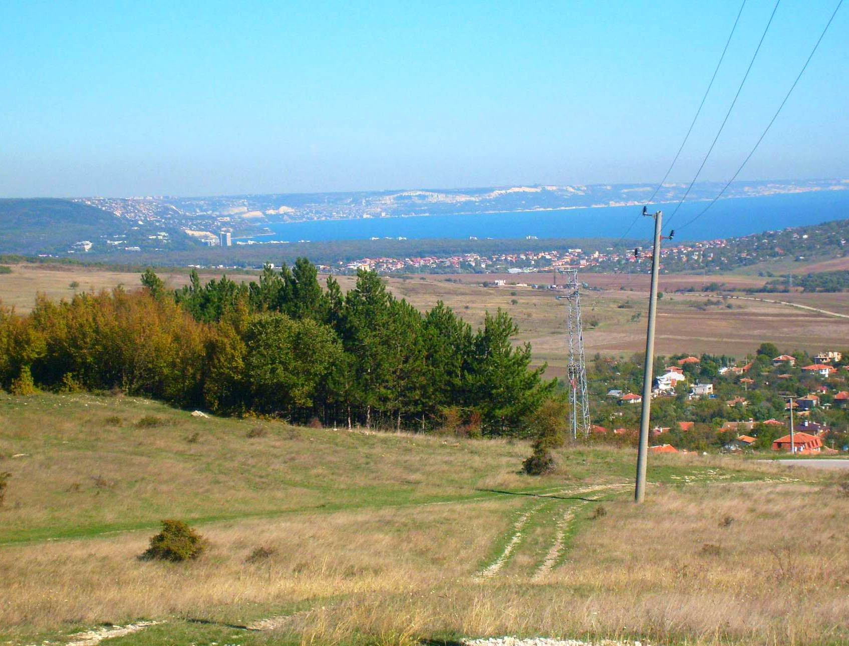 The land is sloping, preserving the views forever. There is low voltage electricity on the plot.